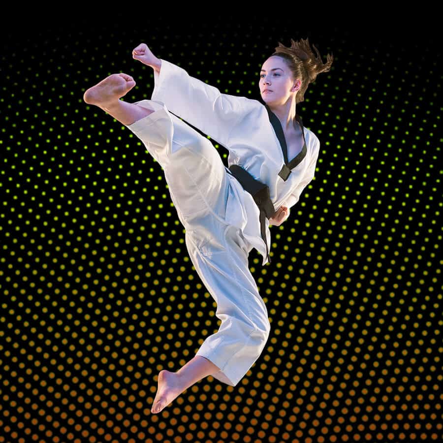 Martial Arts Lessons for Adults in Forney TX - Girl Black Belt Jumping High Kick