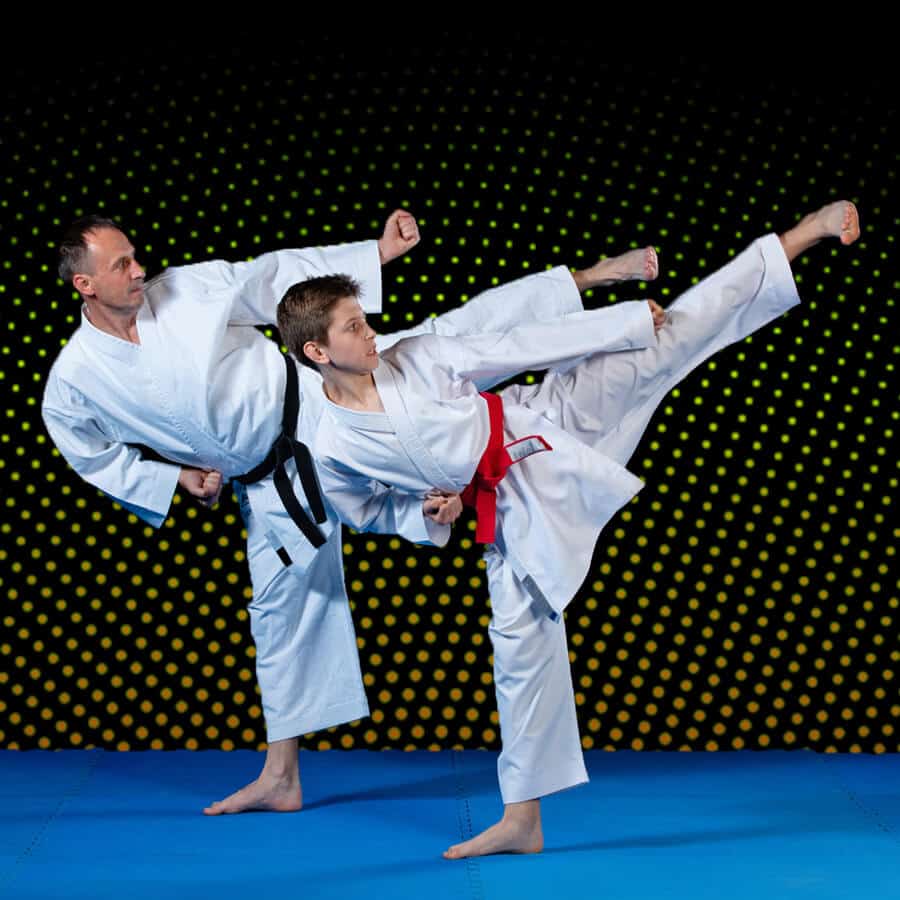 Martial Arts Lessons for Families in Forney TX - Dad and Son High Kick